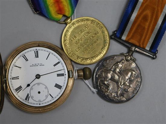 A gold plated pocket watch and pair of 1st WW medals.
